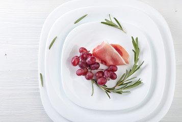 Jamon serrano with rosemary and grape .