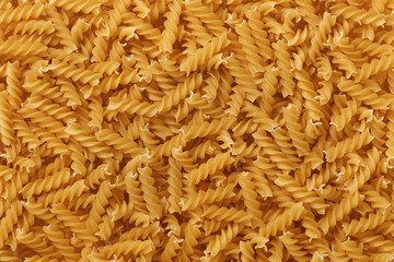 Italian pasta fusilli close-up background