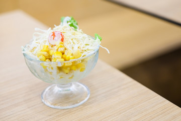 Vegetable (tomato, cabbage & corn) salad serve in clear bowl for homemade food background or texture - Healthy & diet concept.