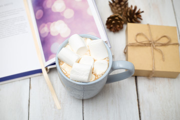 Christmas composition. A cup of hot chocolate and a gift box