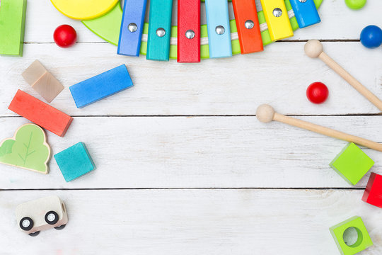 Wooden educational toys on a wooden background