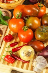 Fresh tomatoes for salad. Preparation of tomato and chilli salad. Diet food. Healthy breakfast.