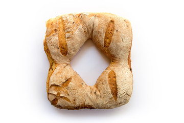 Onion bread in ring form on white background
