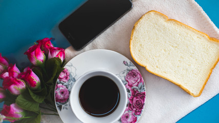 Morning is perfect for your favorite coffee,Coffee cup, soft coffee,Black coffee with bread Good for starting up in the morning.