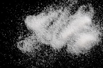 White crystal sugar pile isolated on black background and texture, top view