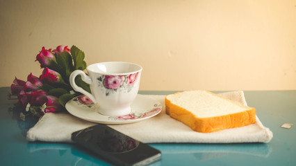 Morning is perfect for your favorite coffee,Coffee cup, soft coffee,Black coffee with bread Good for starting up in the morning.
