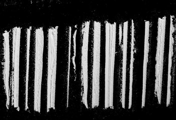 Cocaine lines isolated on black background 