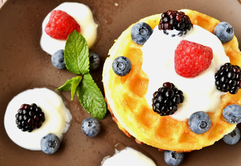 oatmeal with berries on a wooden table, selective focus