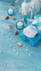 White flowers lying on and candle Spa set