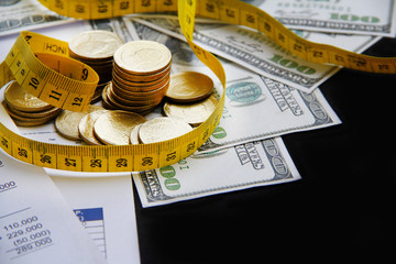 Stack of coins with modern city background. Saving money concept.