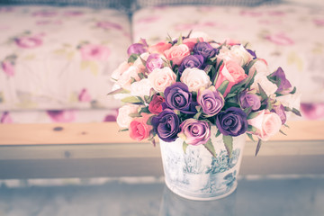 Colorful flower vase in living room, vintage style image.