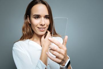 Cheerful delighted woman smiling