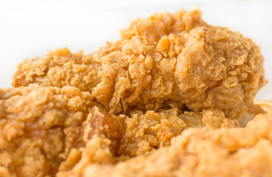Crispy fresh fried chicken close up image.
