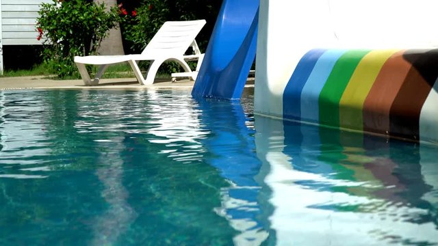 empty swimming pool with slides