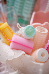 Beauty cosmetic tools and hair accessories in basket.