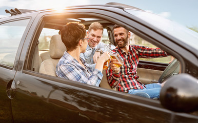 Friends togetherness in the car leaving for vacations.