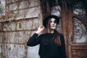 gothic young woman in  halloween costume