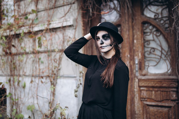 gothic young woman in  halloween costume