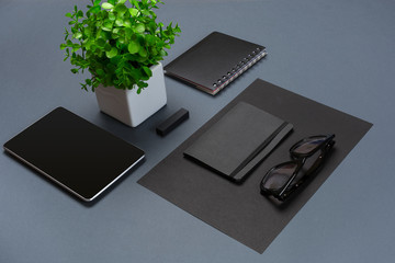 Set of black office stationery on a gray background, flat lay