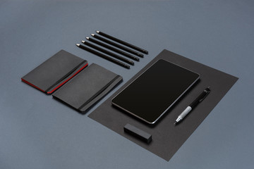 Set of black office stationery on a gray background, flat lay