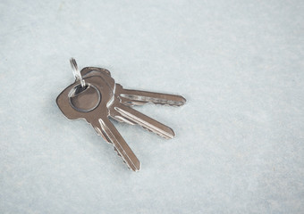 keys lies on cement background.