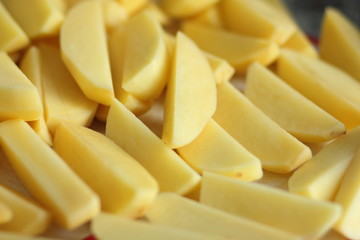 Raw cut potatoes before cooking for designer