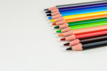 Rainbow of colors with school pencils school supplies and school accessories