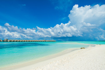 Beautiful tropical landscape of sandy beach and Indian ocean