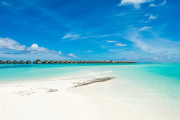 Wooden villas over water of the Indian Ocean, Maldives