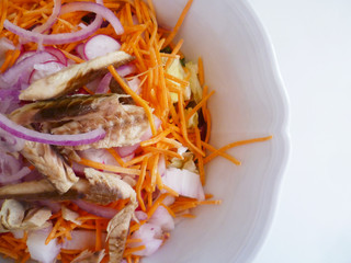 Salad with mackerel fillets and fresh vegetables close up. Top view