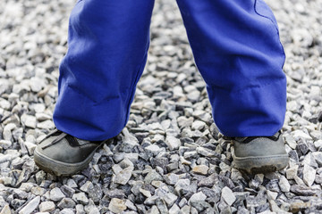 detail of child legs in overalls - boy in workwear