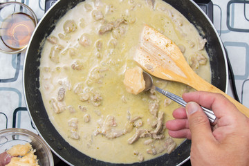 Chef putting cooconut palm sugar for cooking green curry
