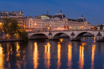 Fototapeta na wymiar Seine River banks, Pont Royal bridge and Orsay Museum at daybreak. Paris, 7th Arrondissement, France