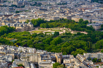 Fototapeta premium Summer aerial view on the Luxembourg Garden, Luxembourg Palace and rooftops in the center of Paris. 6th Arrondissement, Left Bank. France