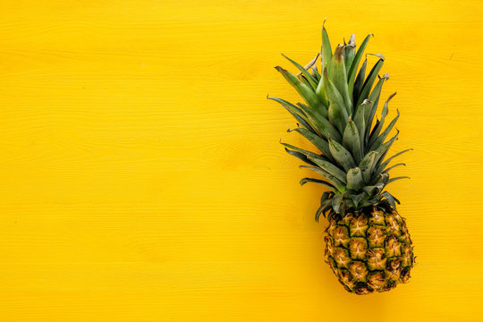 Top view of Pineapple on colorful table. Summer and tropical concept