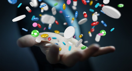Businessman holding and touching floating medicine pills 3D rendering