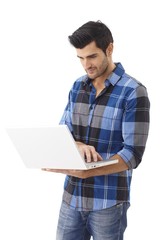 Young man using laptop computer
