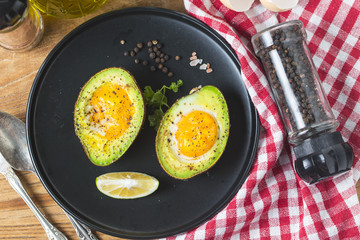 Homemade Organic Egg Baked in Avocado with Salt and Pepper