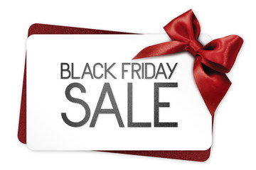 Black Friday sale text write on white gift card with red ribbon bow