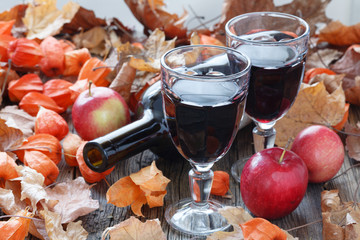 Seasoning wine in glass. Red Leaf on table