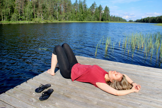 Young beautiful woman enjoy the nature of Finland