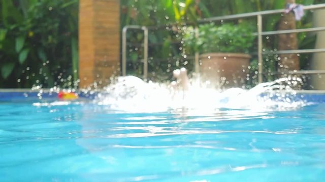 Young woman jumping swimming and swims up, out of pool in slow motion. 1920x1080