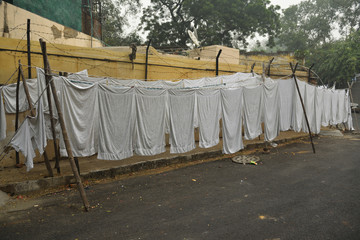 Sheets hanging at Dhobi Ghat - traditional laundry in India