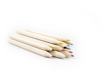 Obraz premium Back to school and classroom supplies with closeup on mix colored pencils on white background