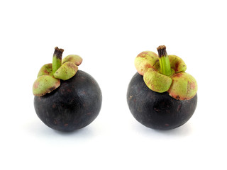 two mangosteen isolated on white, queen of thai fruits