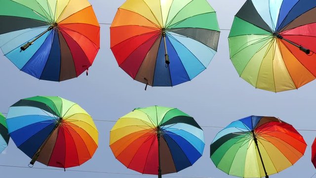 Colourful umbrellas against blue sky