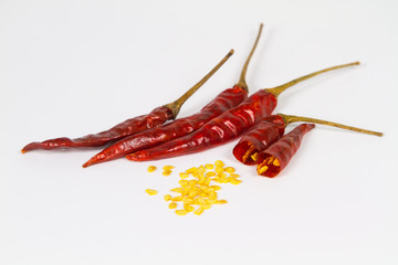 close up of Dried red peppers or red chillis with seed on white background