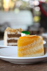 Orange cake on white plate.