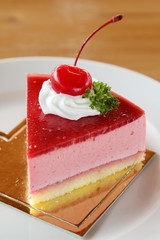 Strawberry cheesecake on white plate.