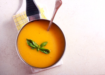 Pumpkin and orange soup in a pan